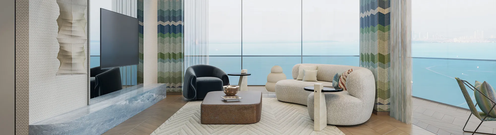 Living room with a curved sofa, a television, and a sea view at The Bay Interiors by Missoni on Dubai Islands